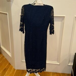 Navy dress with lace sleeves and shape wear inside